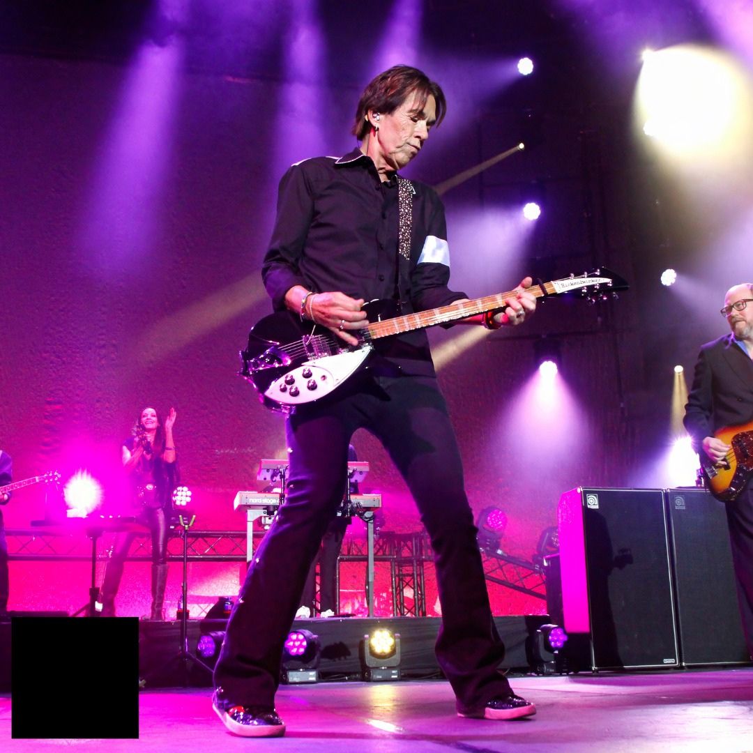 Mushroom Motion multicam concert production — live guitarist performing on stage under purple and white spotlights at a South African live music event
